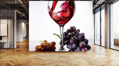 Vino rosso versato in un bicchiere. Wall mural