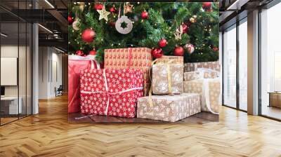 Christmas gifts under the Christmas tree red and wooden toys brick wall. new year 2019 Wall mural