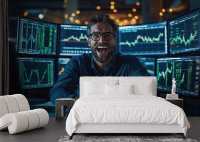 Excited trader celebrating success in front of multiple computer screens showing stock market charts Wall mural