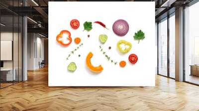 Flat lay pieces of a variety of vegetables on a white background, isolated. Top view Wall mural