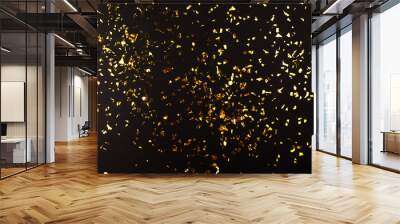 Gold foil confetti on black background. Flatlay. Wall mural