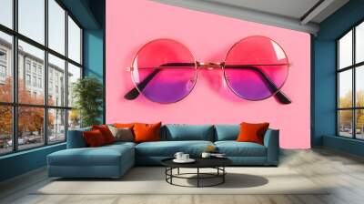 Round summer duotone sunglasses on pink background. Wall mural