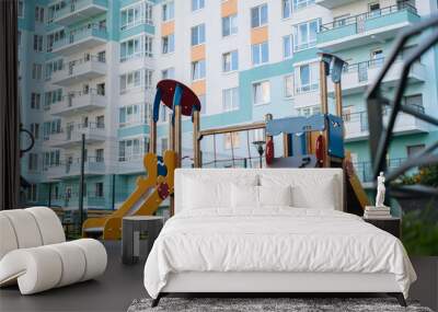 empty children playground. apartment building on background Wall mural