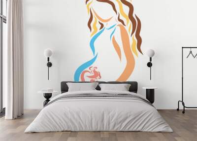 Beautiful young pregnant woman with a baby in the belly Wall mural