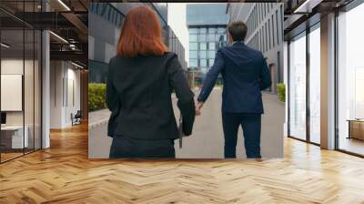 Back view worker two partners people business colleagues coworkers businessman businesswoman walk in city late man motivate woman hurry rush running to urgent meeting at office run together hurrying Wall mural