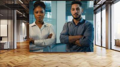 Business diverse coworkers two confident multiracial ethnic colleagues in office posing with crossed hands corporate portrait. African American businesswoman and Indian Arabian businessman cross arms Wall mural