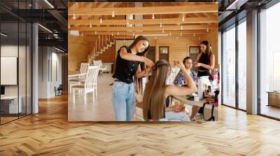 Girls braid their hair. Hairstyles Wall mural