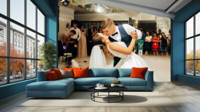 The first dance of the newlyweds on the dance floor. The moment of the kiss Wall mural