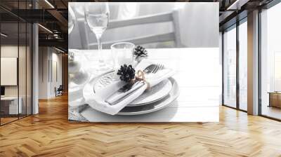 Place table setting on white table with Christmas decor elements. Silver color Wall mural