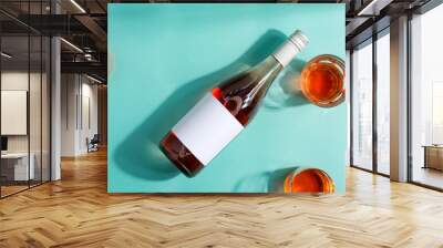 Wineglasses of wine and mock-up bottle of rose wine. Wall mural