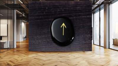 Divination runes made of natural obsidian with gold font Wall mural