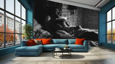 a man in bed wakes up Wall mural