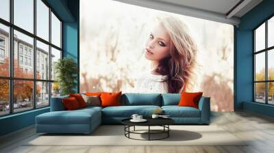 sunny portrait of a beautiful young blonde girl Wall mural