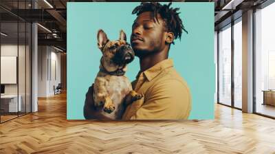 A man is holding a dog and smiling Wall mural