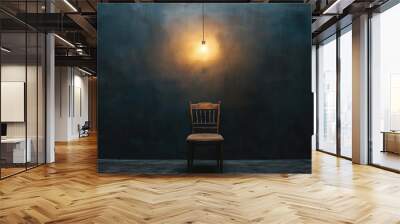 A wooden chair is sitting in front of a wall Wall mural