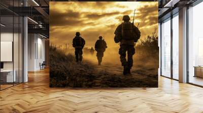 Three soldiers are walking through a field with a sunset in the background Wall mural