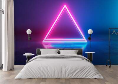 a neon triangle with a gradient of blue to pink light against a dark blue background Wall mural