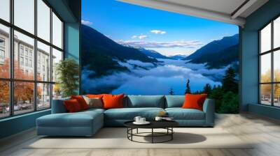 A serene mountain lake, shrouded in morning mist, with a deep blue sky and rolling hills in the background. Wall mural