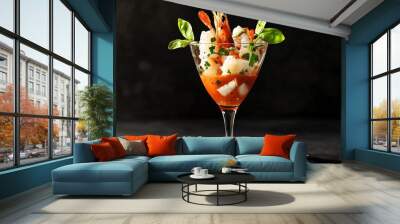 Cocktail glass with shrimp, basil, and tomato sauce on a black background. Wall mural