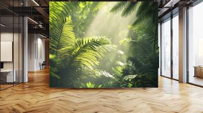 Lush green foliage with sunlight filtering through the leaves in a tropical rainforest. Wall mural