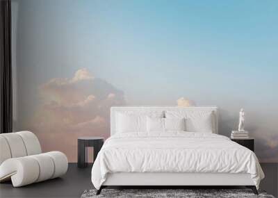 Soft, pink and blue clouds in a light sky. Wall mural