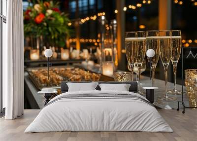 Three glasses of champagne on a table with appetizers and candles. Wall mural