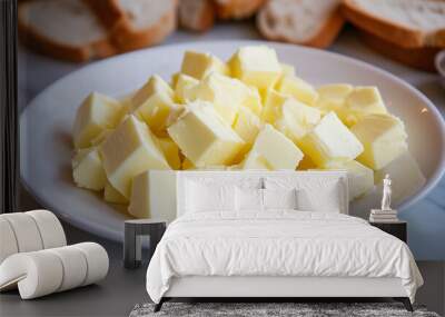 Cubed Butter for Baking: A close-up shot of cubed butter, ready for baking, on a white plate. The butter is glistening and inviting, promising delicious results.   Wall mural