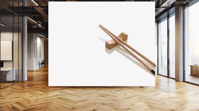 Wooden pairs of chopsticks on white background. cooking culture in Asian countries. Wall mural