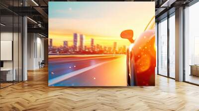 A car speeding on a city highway during sunset with motion blur, capturing the energy and fast pace of urban life.
 Wall mural