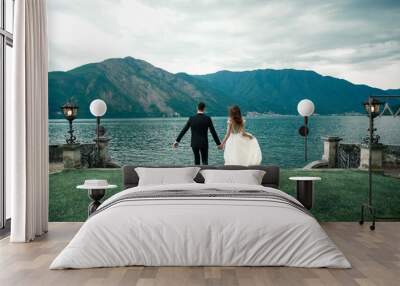 wedding couple the background of the lake and mountains Wall mural