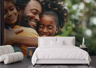 A family of four, two adults and two children, are smiling Wall mural