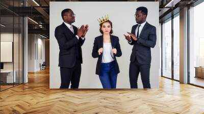 beautiful indian business woman and two African American businessman applauding in the studio on a white background. multinational mixed race teamwork business partners Wall mural