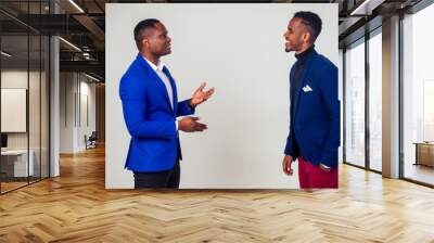 Two successful african american businessmen having communicating in studio white background Wall mural