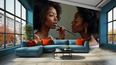 Two women are getting their makeup done Wall mural