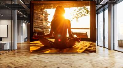 woman sun rays in the form of chakras in tropical yoga studio a view outside to the hills while sunset.girl in eco hotel panoramic windows enjoying solitude with nature Kerala India wildernest resort Wall mural