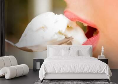 Close-up of pretty woman lips with icecream in the spoon Wall mural