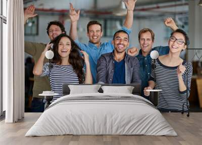 Now thats what I call team spirit. Joyous group of office staff jumping around and having fun together. Wall mural