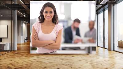 Have big dreams, you will grow into them. Cropped shot of a young businesswoman with her colleagues working in the background. Wall mural