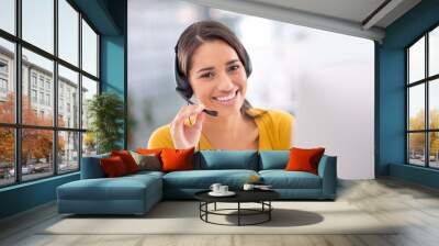 How can I help you today. Portrait of an attractive young customer service representative wearing a headset. Wall mural