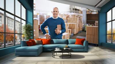 Ive got your shipment ready for transport. Portrait of a mature man standing in a distribution warehouse. Wall mural