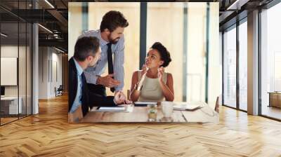 Building success as a team. Shot of a group of colleagues working together in an office. Wall mural