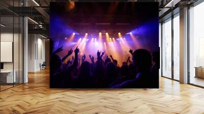 Mesmerized by the music. Shot of a large crowd at a music concert- This concert was created for the sole purpose of this photo shoot, featuring 300 models and 3 live bands. All people in this shoot Wall mural