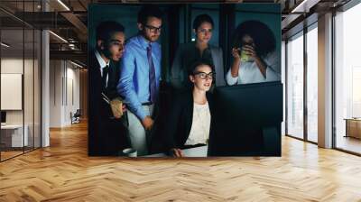 Theyre a team of overachievers. Cropped shot of a diverse group of businesspeople gathered around a single computer in their office. Wall mural