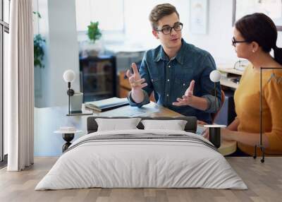 Time for a quick brainstorm. Cropped shot of two coworkers having a discussion in the office. Wall mural