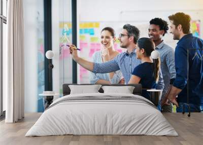 Time for a strategy meeting. Shot of a group of colleagues having a meeting in the boardroom. Wall mural