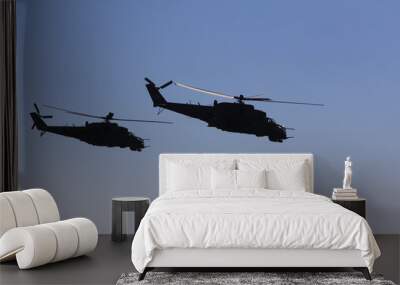 military helicopters fly in the blue sky Wall mural