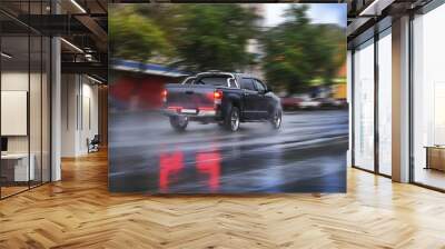 pickup goes on the rainy city street Wall mural