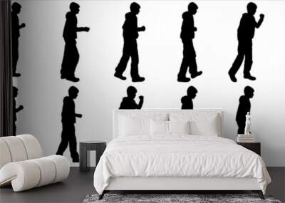 Big set of boy silhouettes standing, walking, isolated on white. Boys in different poses and with different gestures. Boy silhouette, side view. Teenagers go one by one. To animate the steps of a teen Wall mural