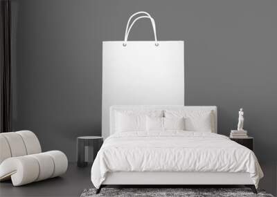 Blank white paper shopping bag isolated on grey front view as template for design presentation, promotion etc. Wall mural