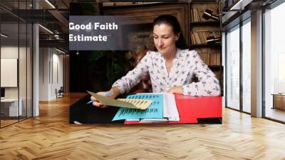  Good Faith Estimate Businesswoman, executive manager hand filling paper business document Wall mural